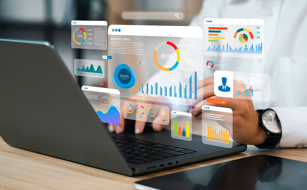 Person working on laptop analyzing charts 